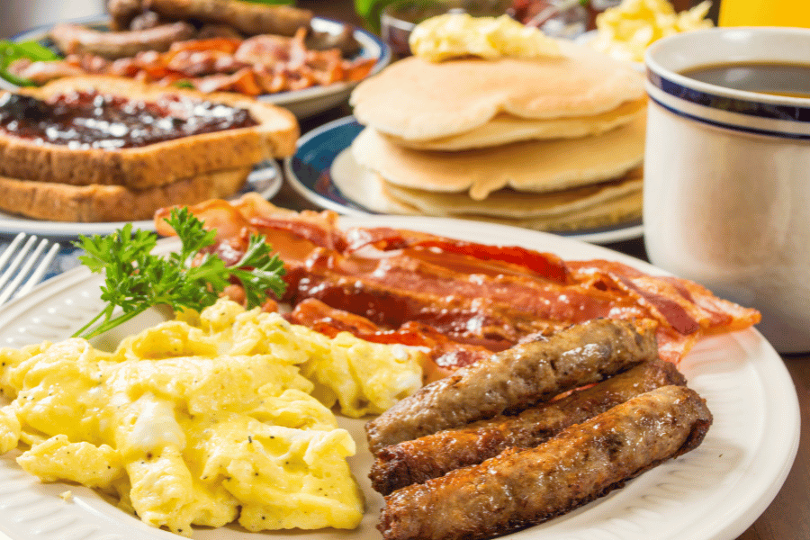 large hot breakfast with coffee pancakes and toast 