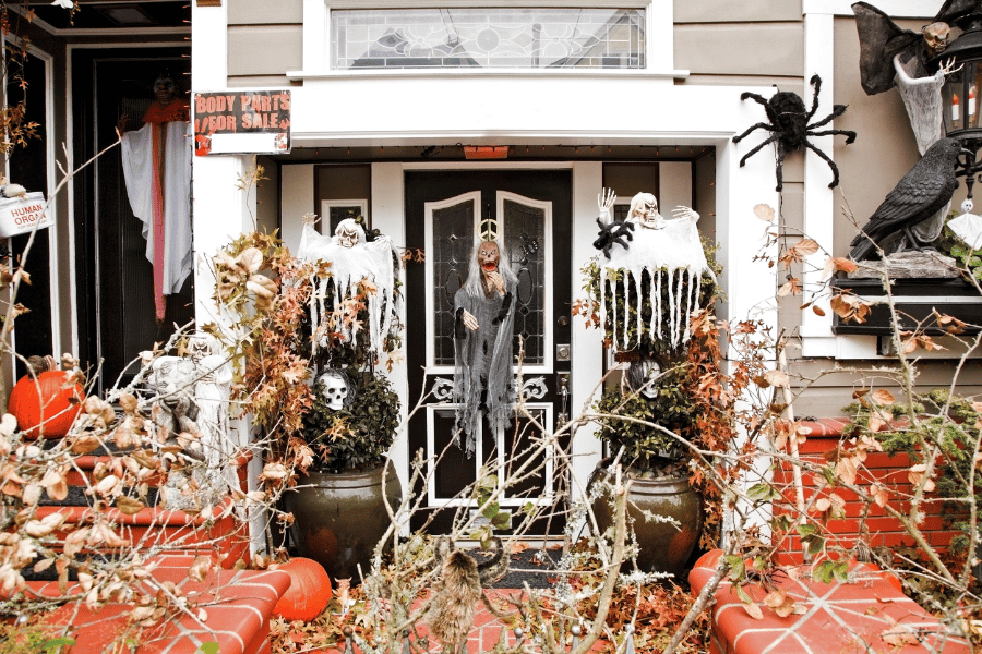 scary Halloween house decorations in the yard and near the front door