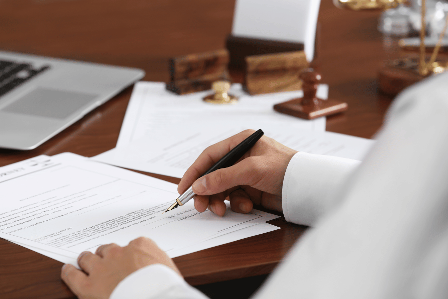 real estate attorney working and drafting legal documents