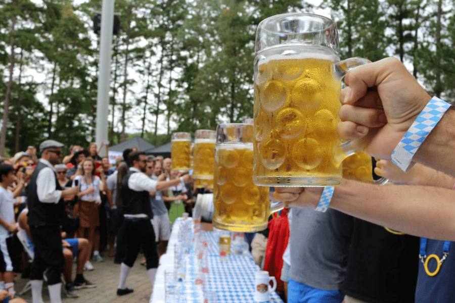 four beers in the air at Oktoberfest