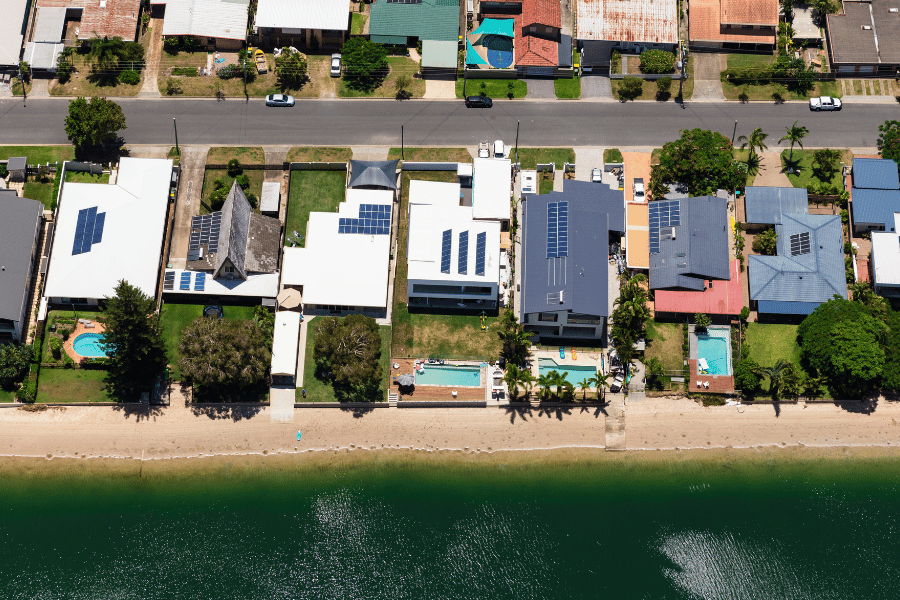 Birds eye view of many waterfront homes 