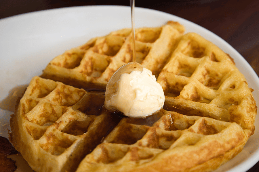 waffle with butter and maple syrup