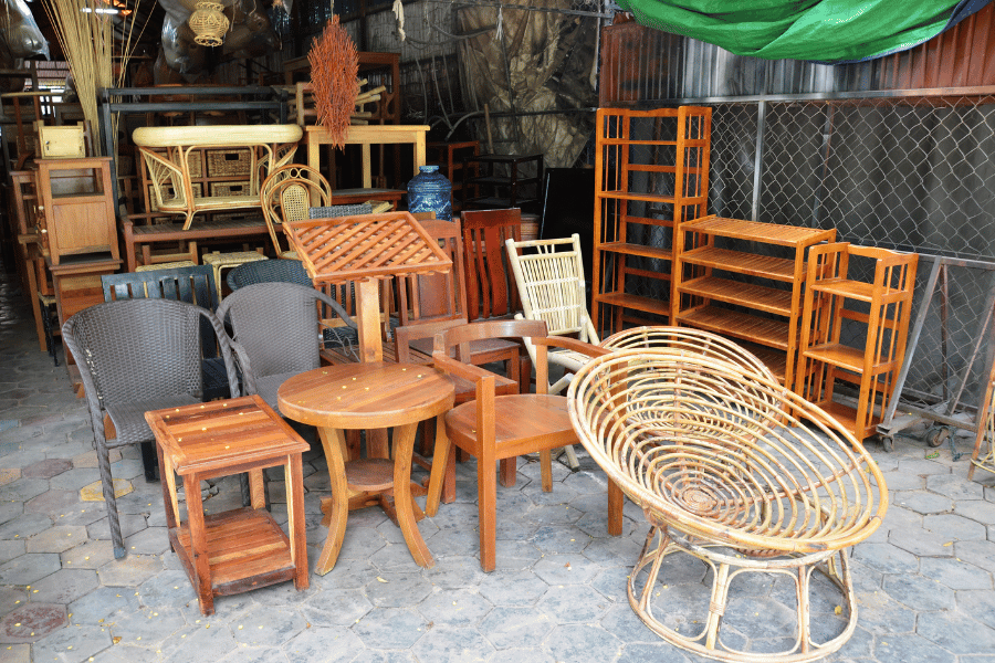 different wood chairs and wood furniture stacked together