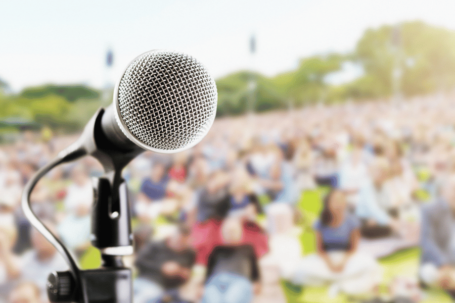 microphone on stage at an outdoor concert on a sunny day