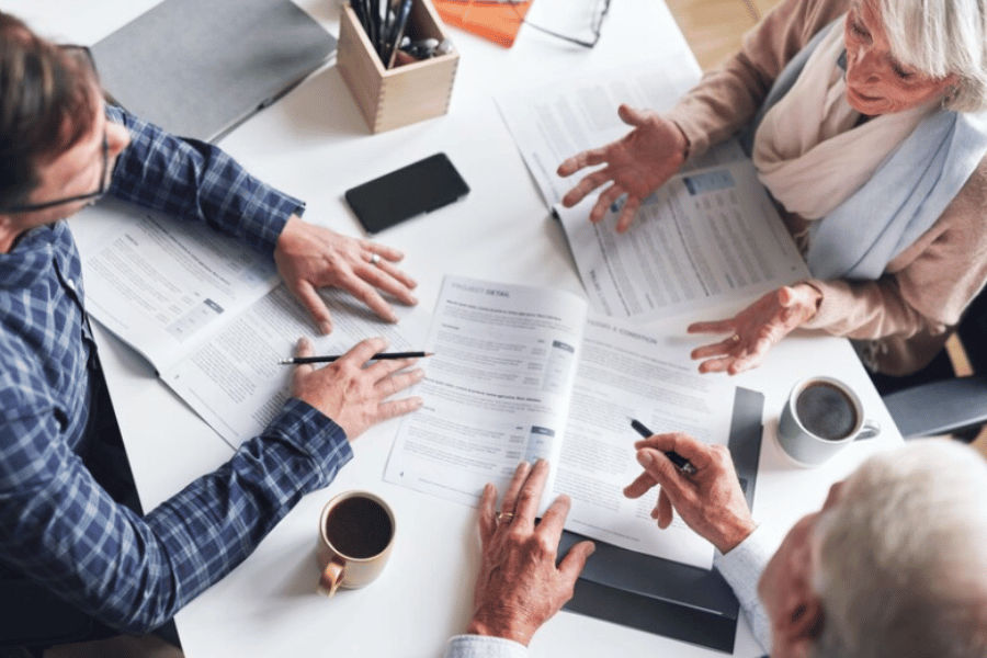 Three people discussing a mortgage