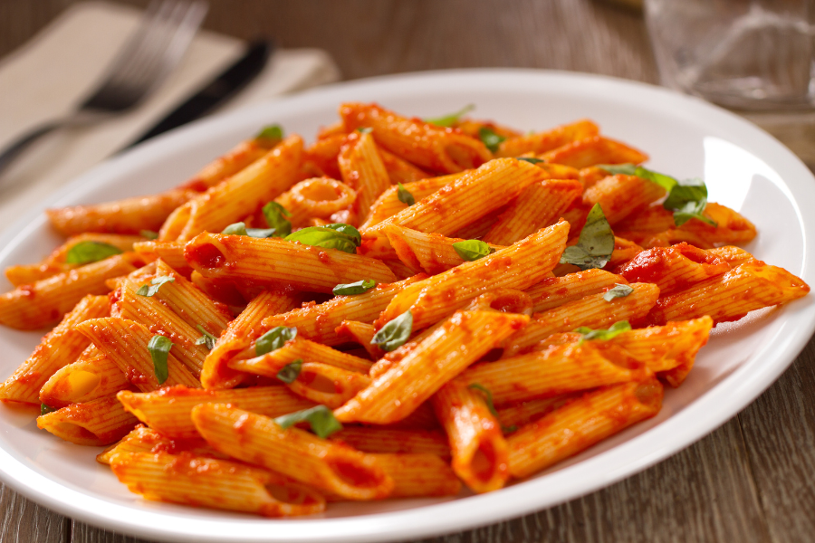 pasta in tomato sauce on a white plate