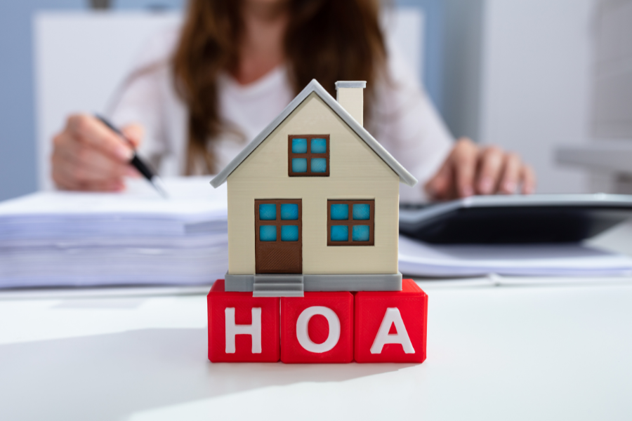Three houses on red letter blocks with letters H,O and A
