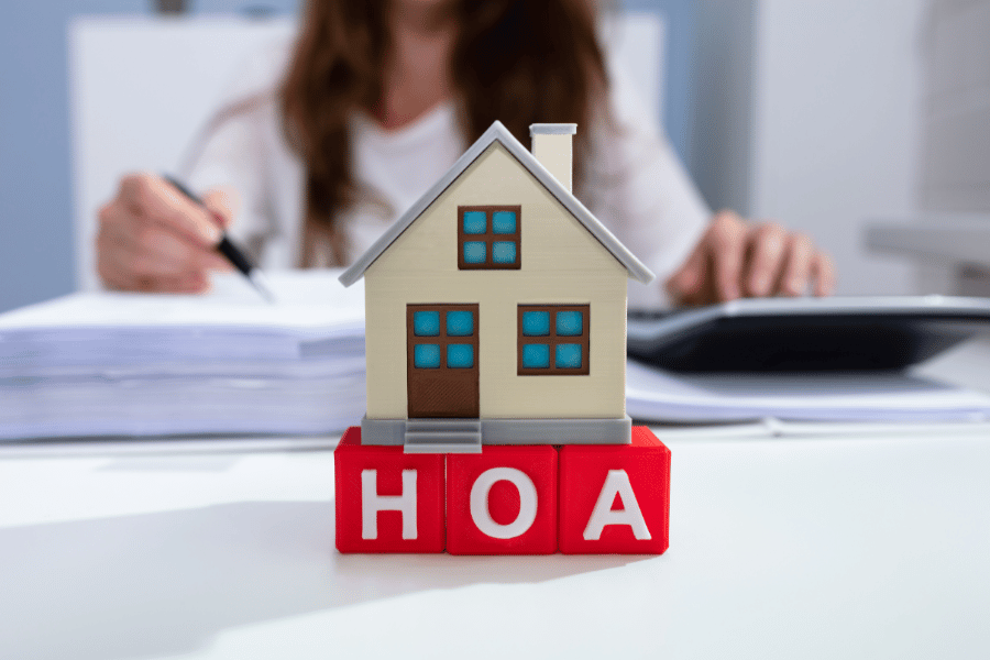 HOA block letters and house 