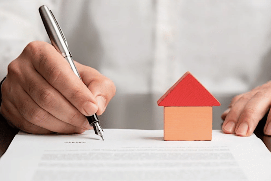 writing on paper with pen and building blocks 