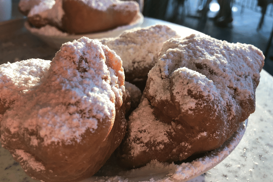 freshly made beignets with powdered sugar 