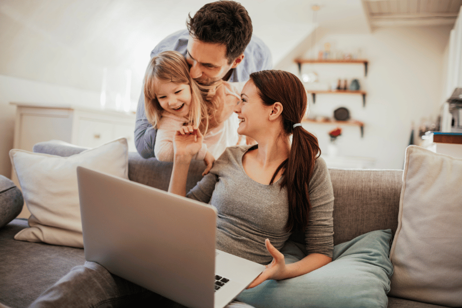 cute family of three conversing and hanging out on the couch