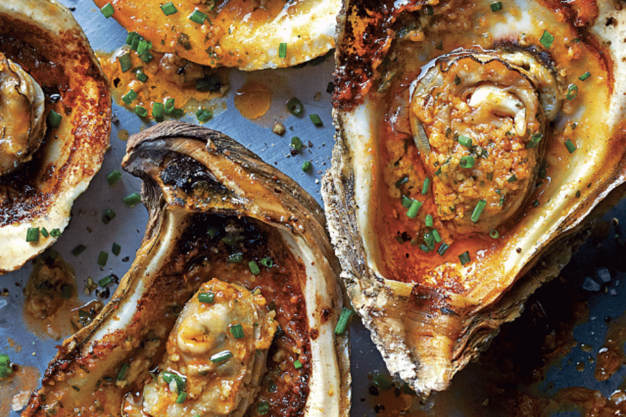 Oysters with seasoning on a plate 