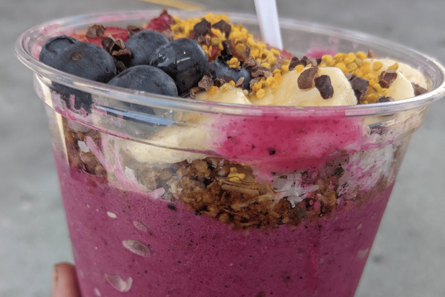 acai bowl with blueberries, bananas, and granola toppings
