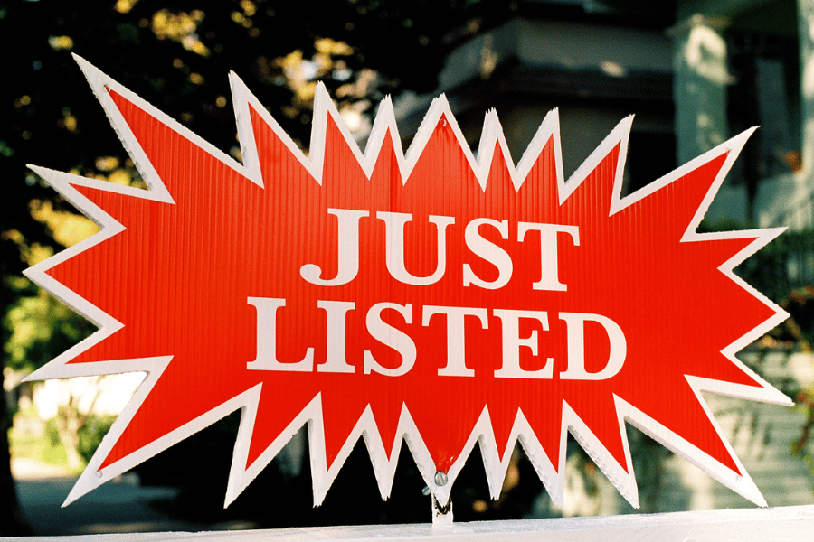just listed red sign for home for sale 