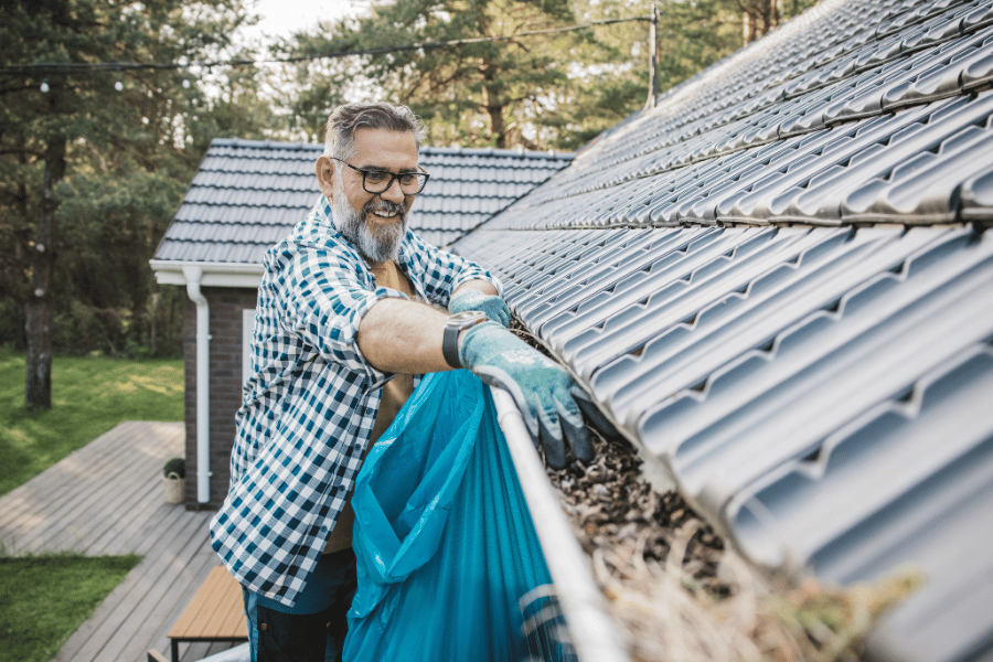 Cleaning out gutter getting ready for winter