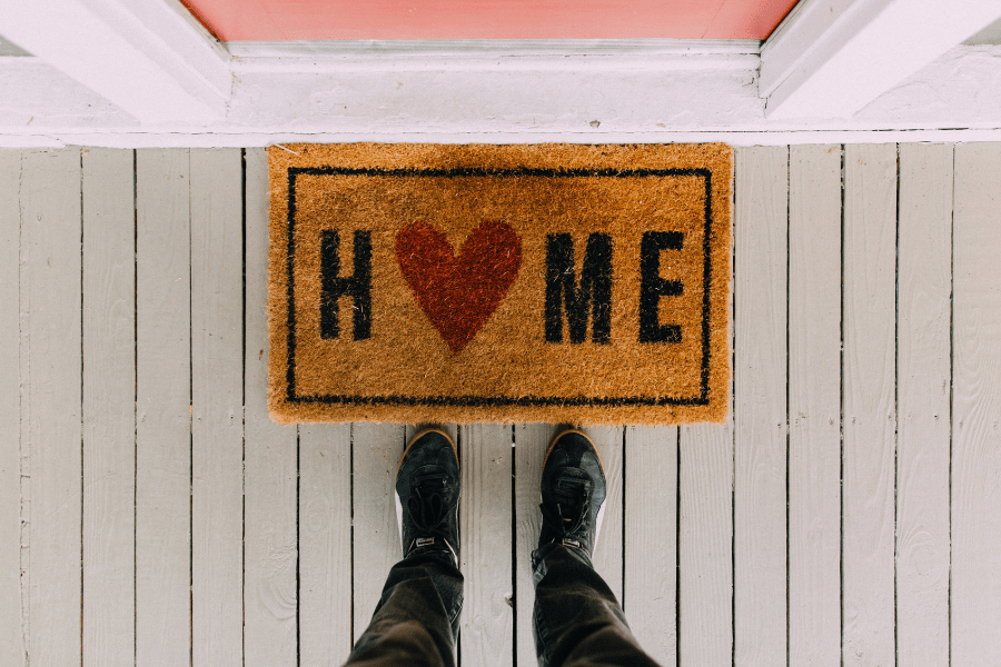home welcome mat on a porch