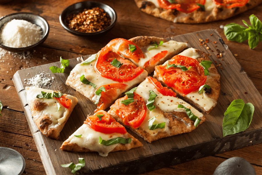 flatbread pizza with tomato and basil
